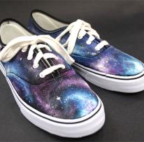 shoes with swirling blue, white and purple patterns appearing like outer space