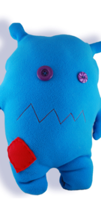 blue stuffed animal with red patch 
