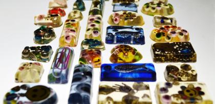 resin rectangle jewelry appears in multiple colours on a white background